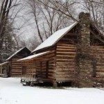 Historic log cabins in winter.